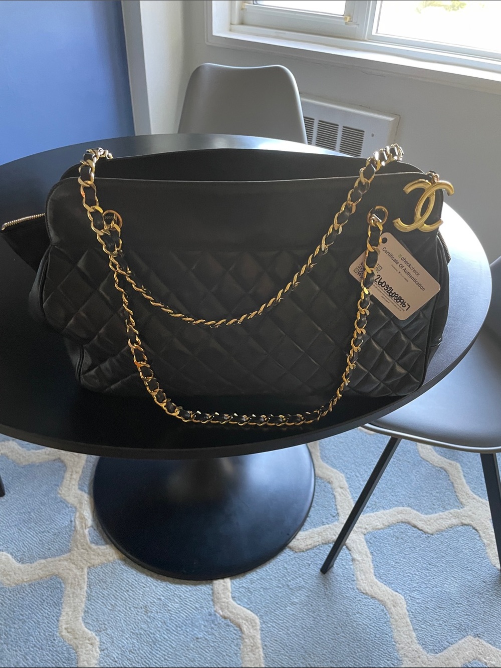 CHANEL Black Quilted Shoulder Bag with Gold Chain & CC Charm